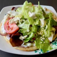 Lamb Gyro · Served with lettuce, tomatoes, onions and gyro sauce on pita bread.