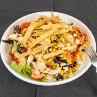 Southwest Chicken Salad · Grilled chicken, green tender mix, peppers, tomatoes, black bean corn relish, tortilla strip...
