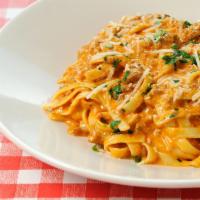 Fettuccine Bolognese · Meat ragu with creamy rose.
