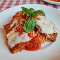 Veal Parmigiana · Grande. Veal scallopini with Squisito tomato sauce, mozzarella cheese, and capellini pasta.