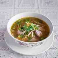 D15R. Rice Noodle Soup · Rice noodle soup with cilantro, onions, bean sprout and topped with fried garlic. Served wit...