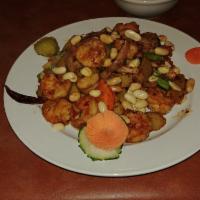 S2. Kung Pao Shrimp · Shrimp sauteed in a rich brown sauce with dry hot peppers, peanuts, diced bamboo shoots and ...