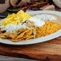 Chilaquiles · Rice, beans, salsa, cheese, sour cream, 3 eggs and tortillas,Option of green or red salsa.