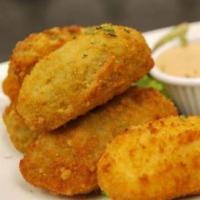 Jalapeno Poppers · 5 poppers. Fried jalapenos stuffed with cheddar cheese.
