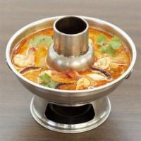 S1. SMALL Tom Yum · Lemongrass soup with tomato, white onion, green onion, cilantro, and mushroom. Spiced with T...