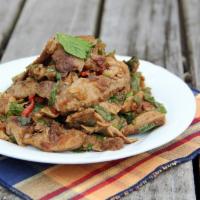 SA4. Nam Tok · Grilled pork seasoned with fresh Thai herbs, Thai chili, roasted rice powder, and house dres...