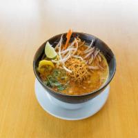 N7. Kao Soi · Special curry sauce with coconut milk, egg noodle, red onion, lime, chili oil, pickles, and ...