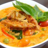 SP3. Duck Curry · Special house duck simmered with pineapple, basil, bell pepper, and tomatoes, in a red curry...