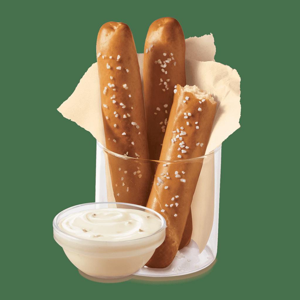 DQ® Bakes!® Pretzel Sticks with Zesty Queso · Soft pretzel sticks, served hot from the oven, topped with salt and served with warm zesty queso dipping sauce.