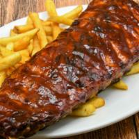 Bbq Ribs Full Rack · Pork loin back ribs, beer braised and slow cooked with our tavern BBQ sauce and a side of fr...