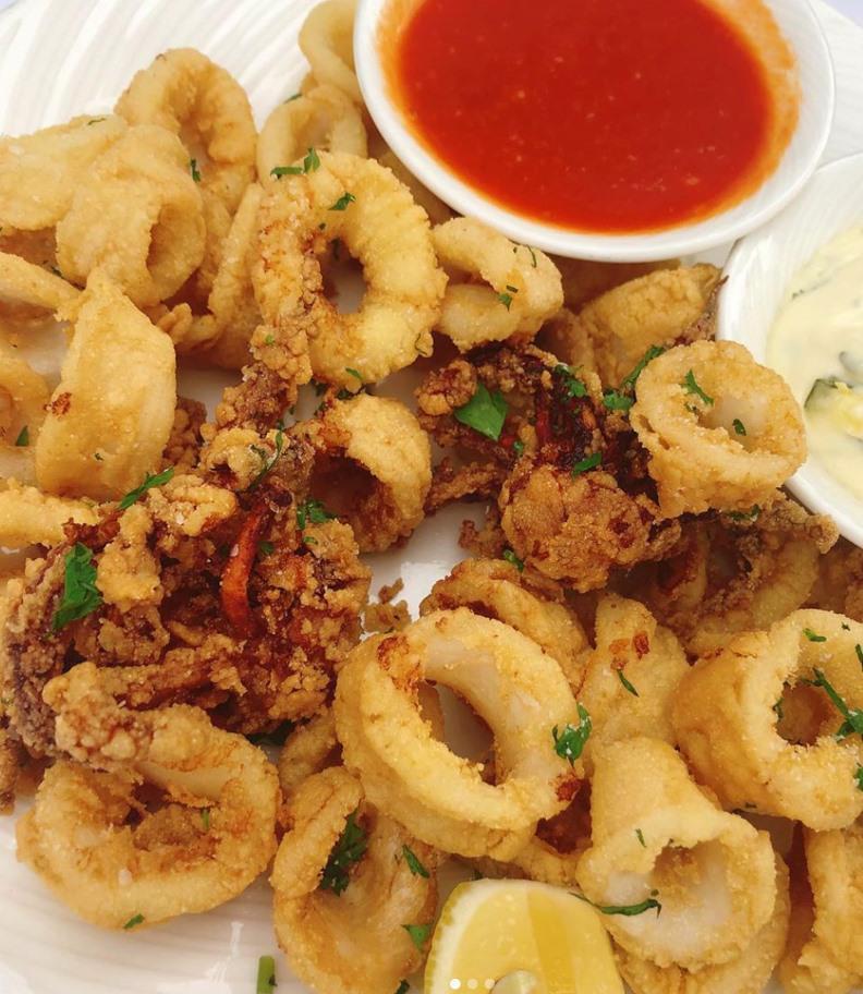 Calamari · Rings of fresh local squid, lightly fried with marinara, and lemon aioli.