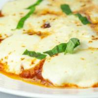 Chicken Parmigiana · Breaded organic chicken breast, tomato, fresh mozzarella.