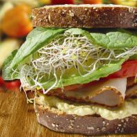 Hummus Sandwich · Fresh homemade hummus, avocado, tomatoes, spinach and alfalfa sprouts. Served on whole wheat...