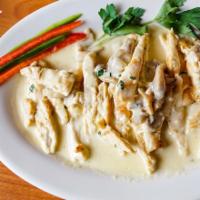 Chicken with Creamy White Mushroom Sauce · Chicken breast grilled and sliced and mixed with the creamy mushroom sauce. 2 sides.