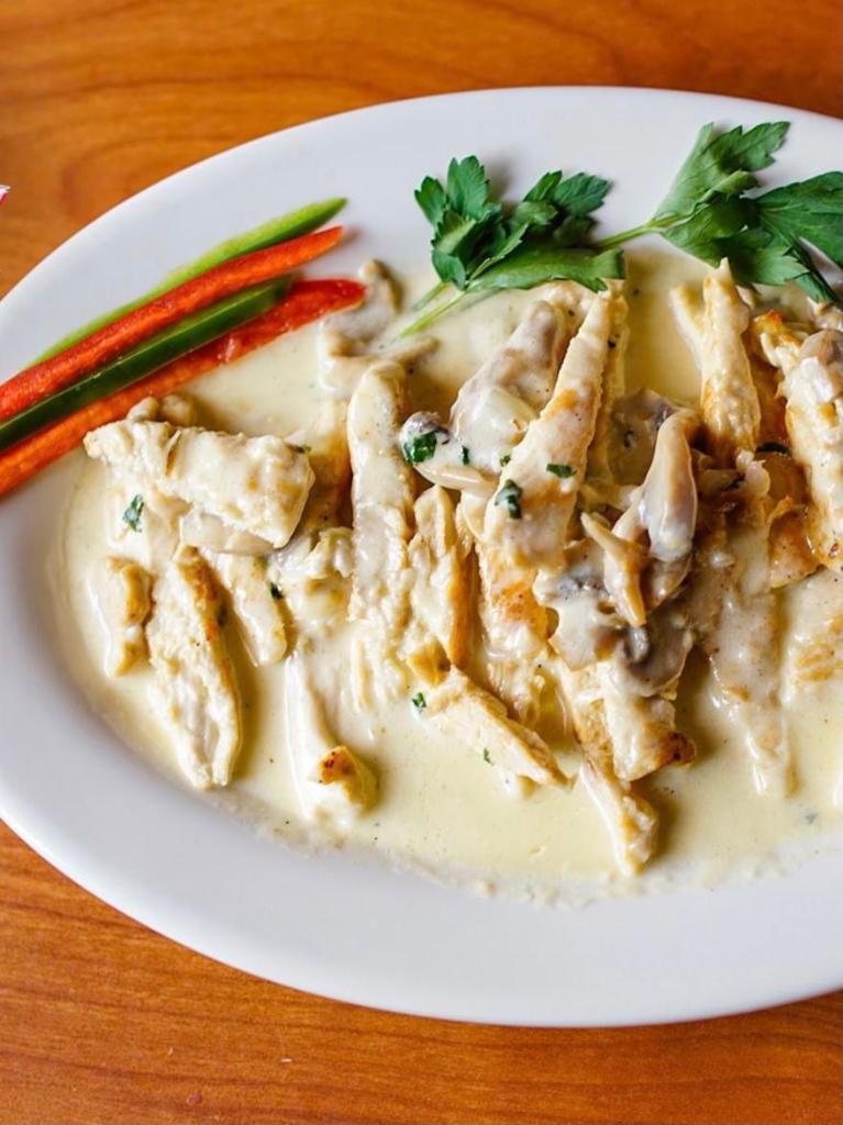 Chicken with Creamy White Mushroom Sauce · Chicken breast grilled and sliced and mixed with the creamy mushroom sauce. 2 sides.