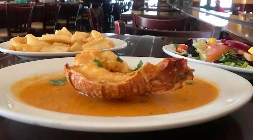 Lobster Tail in Garlic Sauce · Comes with 2 sides of your choice! 