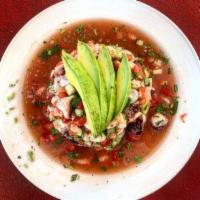 Ceviche · Chopped shrimp or fish cured with lemon juice, onion, tomato, cilantro, and cucumber topped ...