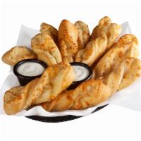 Garlic Twists · Freshly rolled signature dough, flavored then baked to perfection.