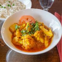 Aloo Gobi · Potatoes and cauliflower cooked with fresh tomatoes, cilantro and cumin. Includes rice.