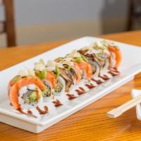 35. Dancing Yellowtail Roll · Crunchy spicy yellow tail and avocado inside; salmon, eel, sliced almonds, wasabi mayo, and ...