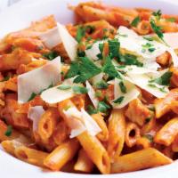 Penne and Grilled Chicken a la Vodka Pasta · Penne pasta simmered in a creamy vodka sauce topped with tender grilled chicken breast, shav...
