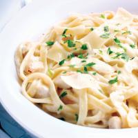 Fettuccine Alfredo with Grilled Chicken · Fettucdne noodles and tender grilled chicken tossed in a rich, creamy Alfredo sauce made wit...