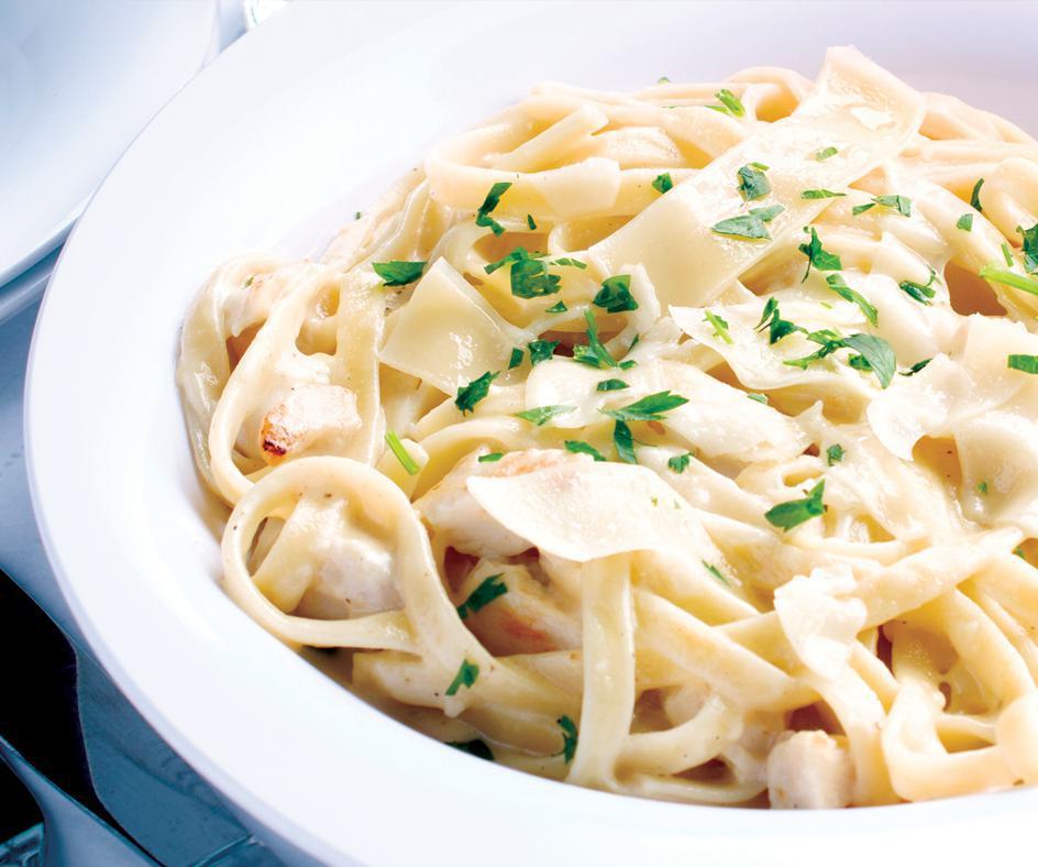 Fettuccine Alfredo with Grilled Chicken · Fettucdne noodles and tender grilled chicken tossed in a rich, creamy Alfredo sauce made with Asiago and Romaano cheeses with a hint of garlic and fresh parsely.