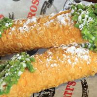 2 Cannolis · Crisp Sicilian pastry shells filled with sweetened ricotta and chocolate chips, dipped into ...