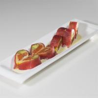 Valentine Roll · Spicy crunchy tuna with avocado inside, tuna outside and wasabi aioli.