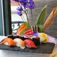 Sushi and Sashimi Lunch · 6 pieces sashimi, 3 pieces sushi and 1 tuna roll. Served with miso soup or ginger salad.