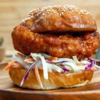 KFC Sandwich · Korean fried chicken breast tossed in a sweet and spicy Korean Chile sauce served with pickl...