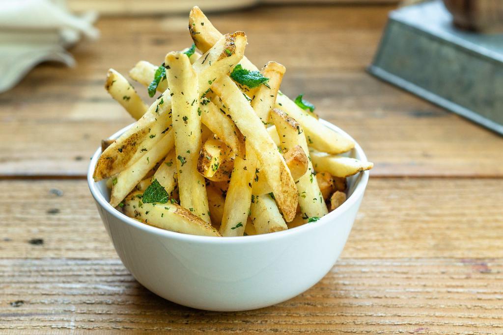 Garlic Herb Fries · Crispy natural cut fries tossed in fresh herbs and garlic oil. Served with side of garlic aioli.