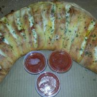 Veggie Deluxe Calzone · Fresh mushrooms, black olives, artichoke hearts, fresh tomatoes, onions, green peppers and m...