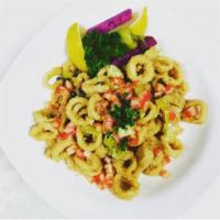 Calamari · Sauteed with lemon butter and capers topped with tomatoes and pepperoncini.