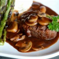 Filet Mignon · Topped with mushrooms, demi glaze sauce and served with charbroiled vegetables.