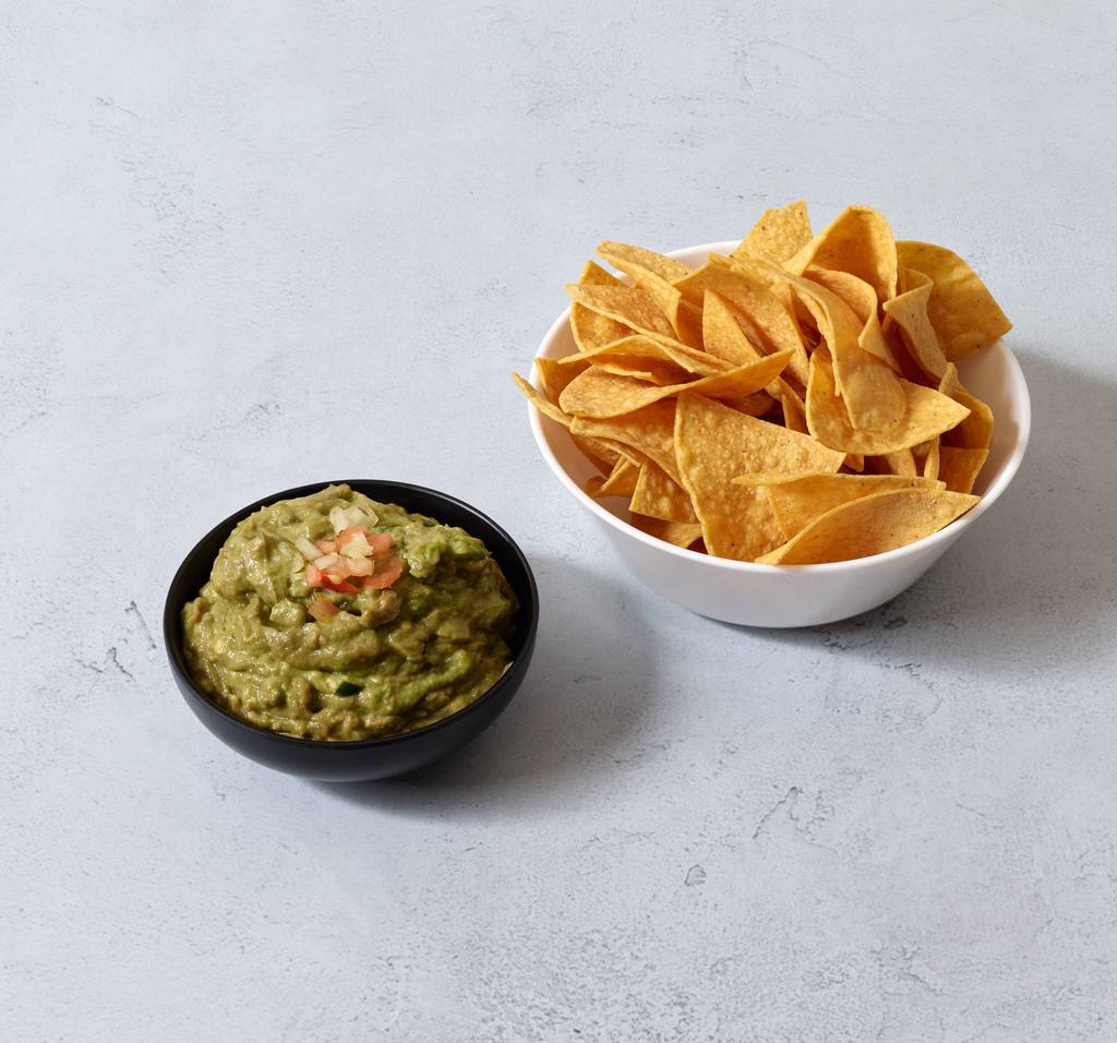 2. Guacamole · With onions, cilantro and chile. Served with warm chips. 