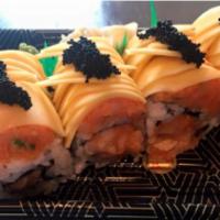 Mango Dancing Roll · Spicy white tuna and crunch inside, topped with spicy yellowtail, mango, and tobiko.