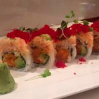 Dynamite Roll · Spicy yellowtail, salmon, avocado inside, top with lobster salad, jalapeno, and red tobiko.