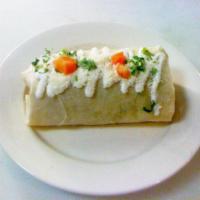 Steak Burrito · Flour tortilla stuffed with rice, beans, cheese, lettuce, guacamole & sour cream.