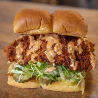The Hot Chick · Nashville-style beer batter fried or grilled chicken tenders, haus slaw, pickles, and secret...