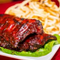 Baby Back Ribs · Served with house-made coleslaw.