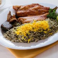 Trout Fish · A whole, fresh trout fish marinated and pan-fried, served with sabzi polo rice topped with s...