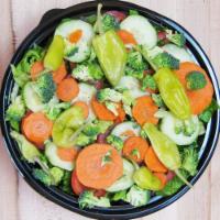 Garden Salad · Fresh romaine lettuce, tomatoes, carrots, cucumbers and broccoli. Croutons and choice of dre...