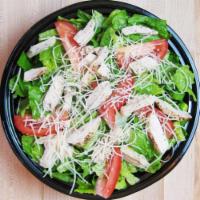Chicken Caesar Salad · Roasted chicken, romaine lettuce, tomatoes, shredded Parmesan and garlic croutons, served wi...