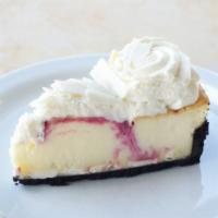 White Chocolate Raspberry Cheesecake · Creamy cheesecake swirled with white chocolate and berries.