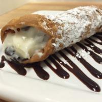 Cannoli · Traditional cream with chocolate chips, topped with light powdered sugar.