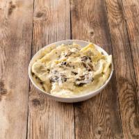 Porcini Wild Mushroom Ravioli · Porcini ravioli topped with a delicious mushroom alfredo cream sauce and roasted mushrooms.