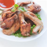 9. Peak Gai Tod · Served with sweet and sour sauce garlic marinated deep-fried chicken wings.