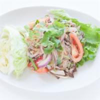 19. Yum Woon-Sen Salad · Silver noodles mixed with minced pork, shrimp, black fungus, red and green onion chili paste...