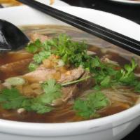 63. Roast Duck Noodle Soup · Roast duck and bean sprouts.
